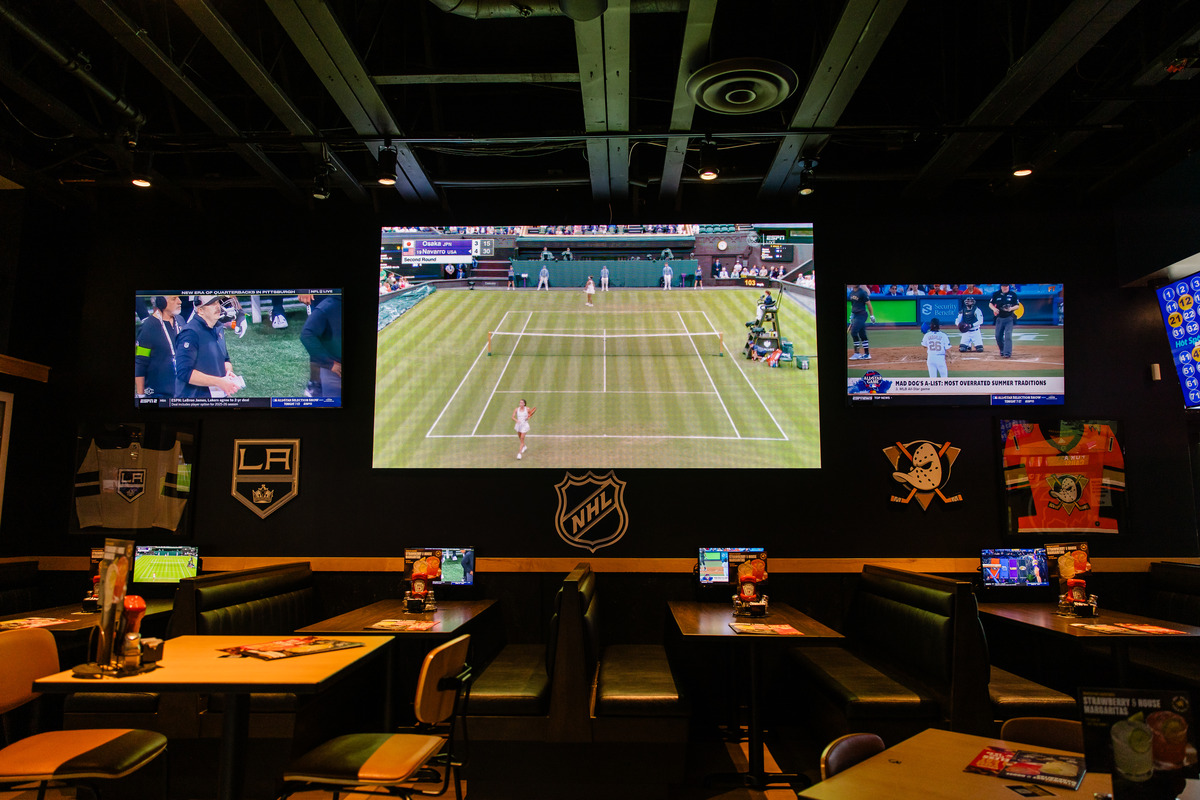 A tennis match playing on an LED screen in Buffalo Wild Wings